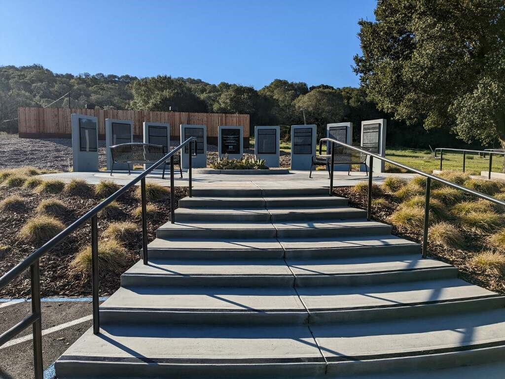 California Memorial Project monument at Napa State Hospital featuring nine large freestanding plaques inscribed with the names of patients buried on the grounds.